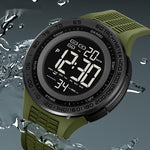 Digital watch with green strap and water splashes