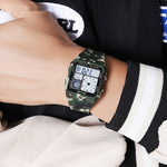 Camouflage digital watch on a wrist